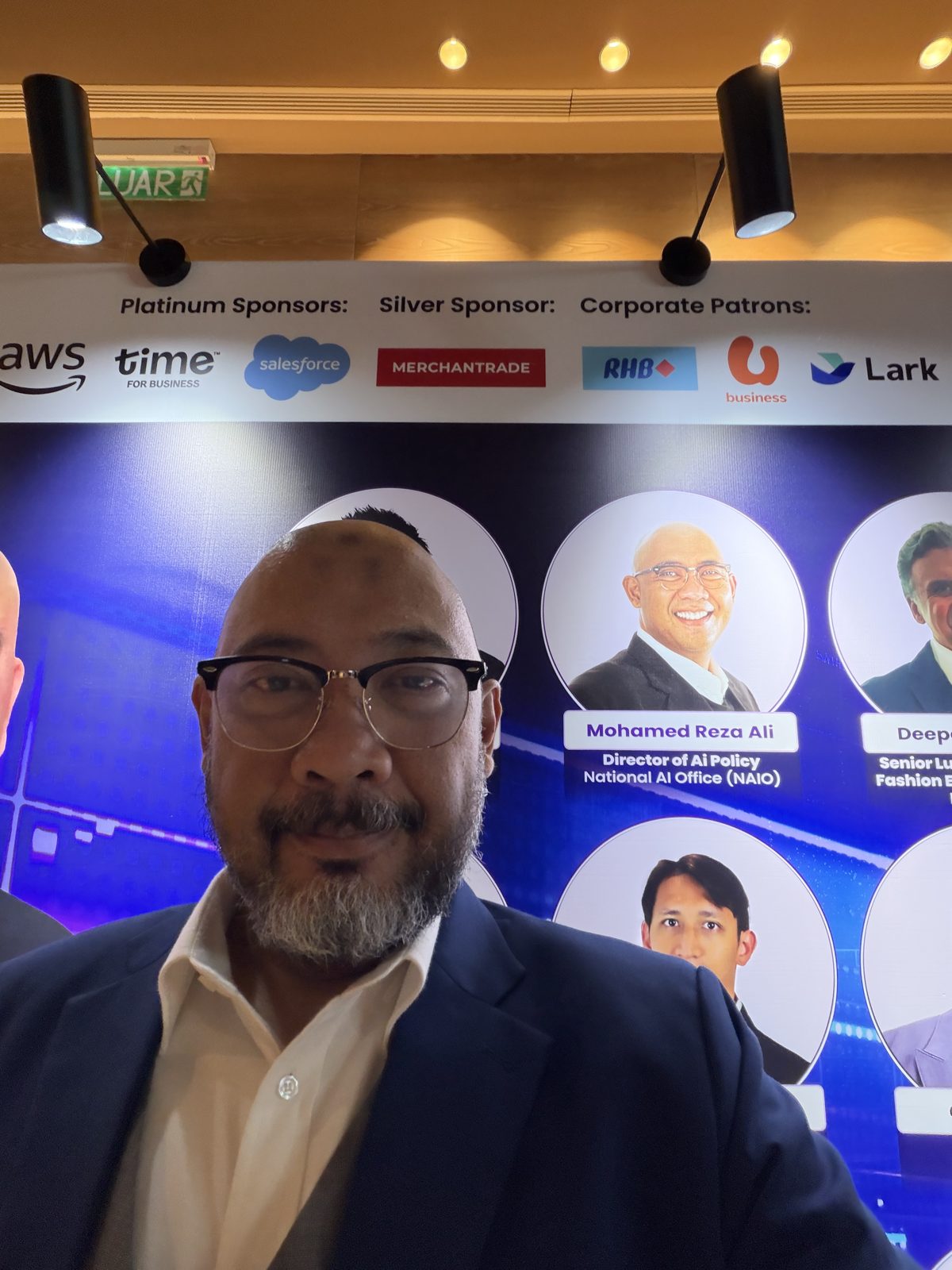 Reza Ali in front of the MRCA Retail Tech Summit 2026 speaker backdrop